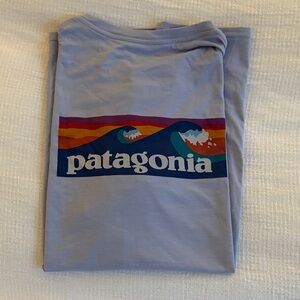 Patagonia Lavender Tee with Vibrant Wave Graphic